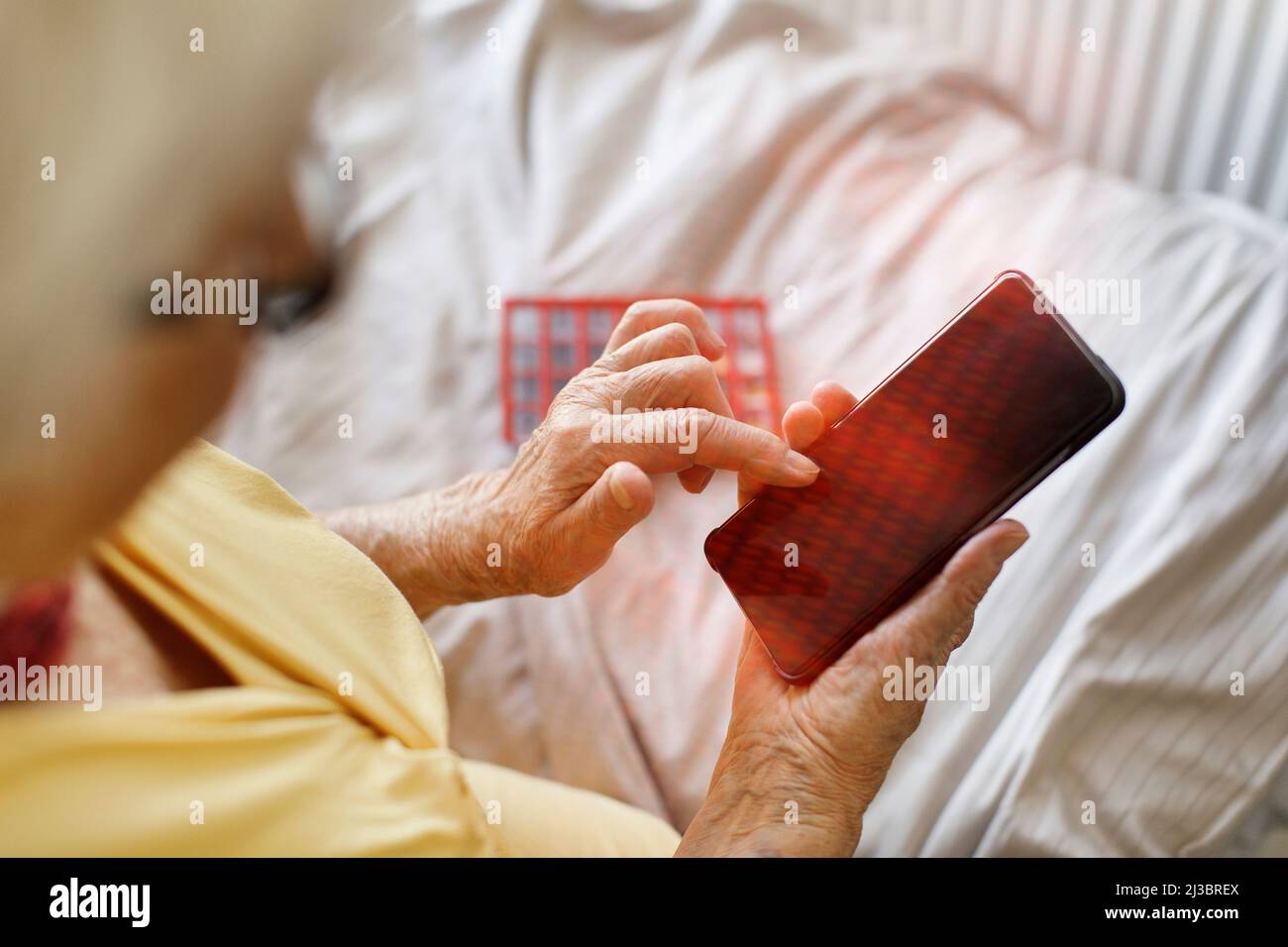 Senior woman using smart phone Stock Photo