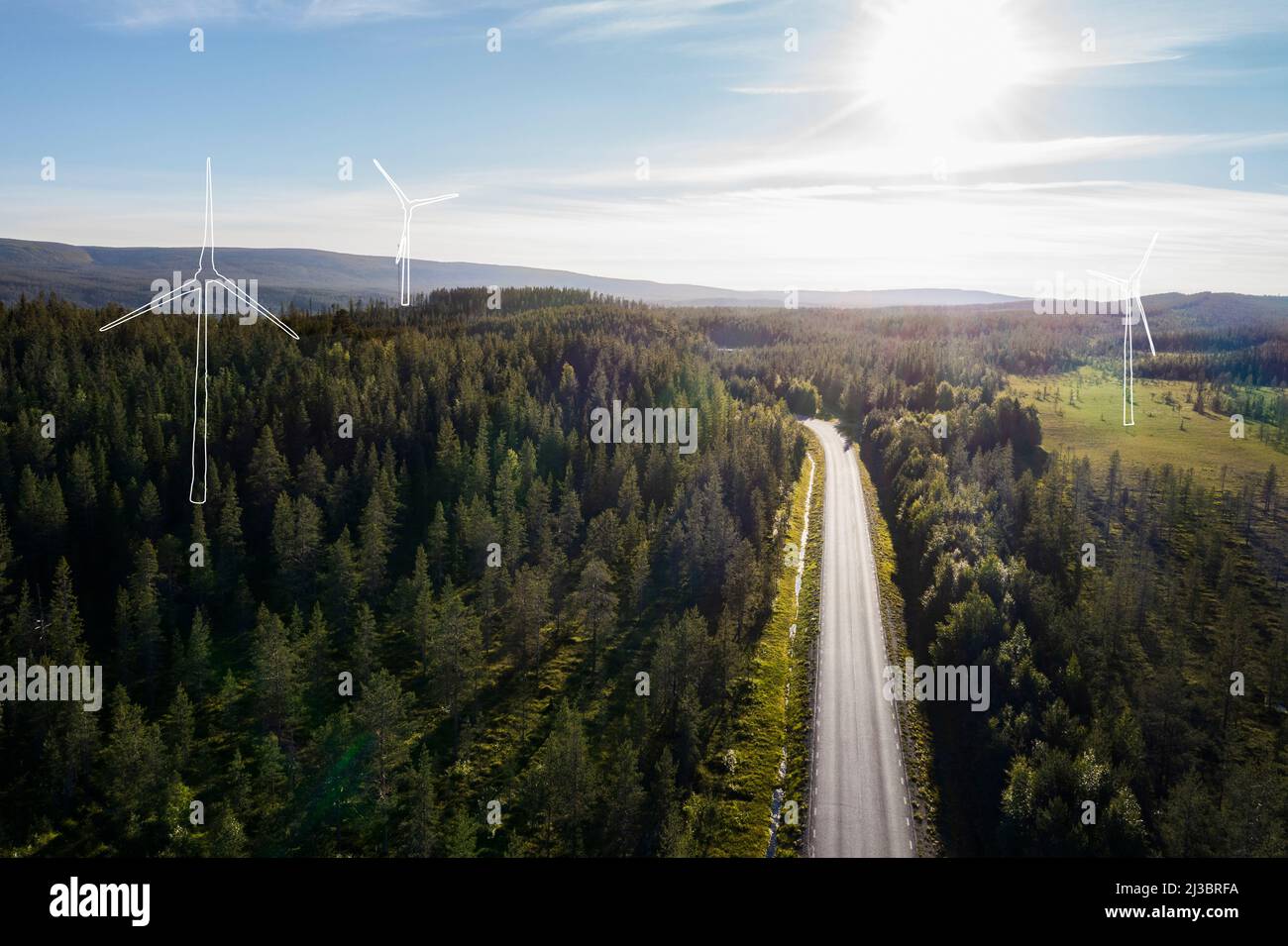Wind turbines models in green landscape Stock Photo - Alamy