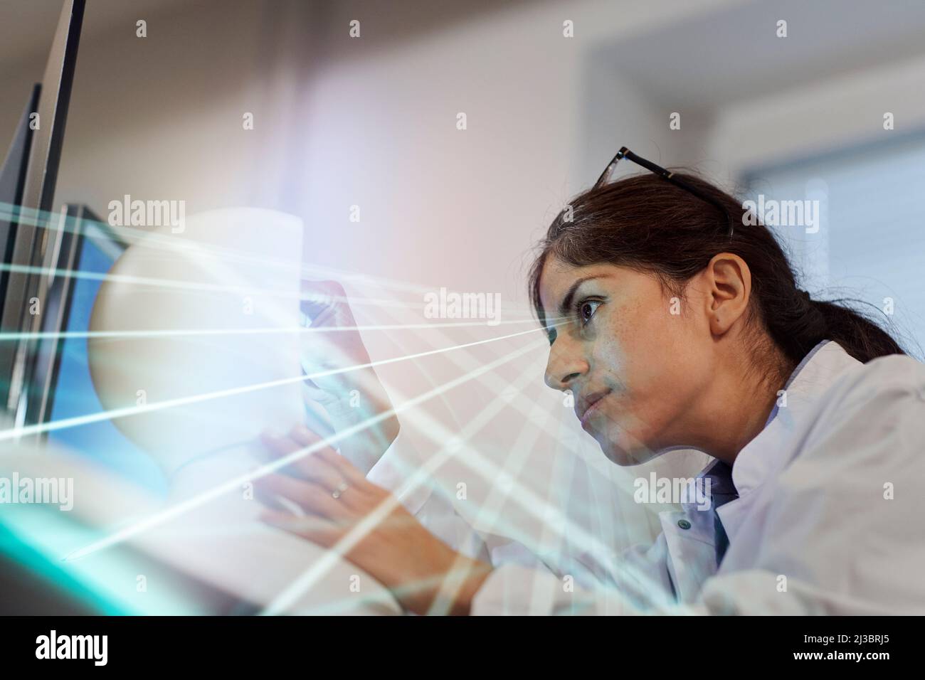 Young female engineer building robot Stock Photo
