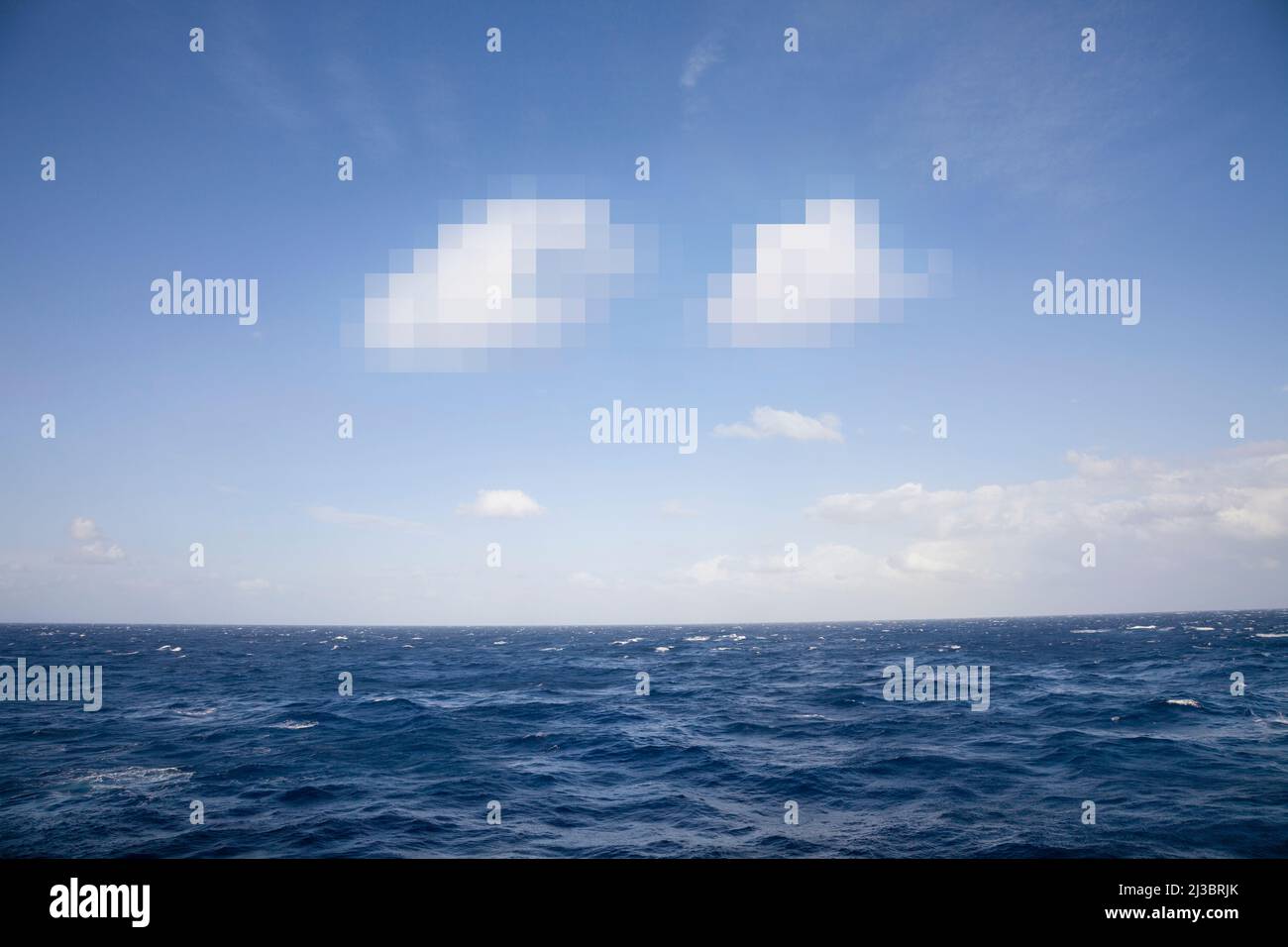 Pixelated clouds in blue sky and sea Stock Photo