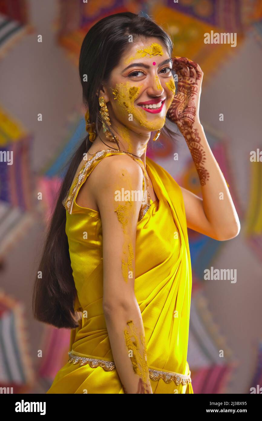 Portrait of a beautiful Indian bride looking at camera with crossed-eyes Stock Photo