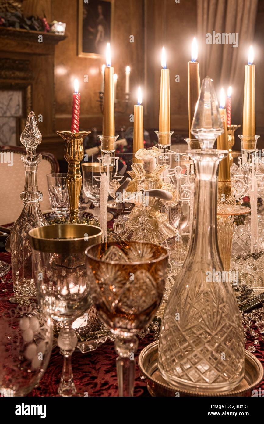Venetian glass and lit candles in Grade II listed mansion,  Cambridgeshire, England, UK Stock Photo