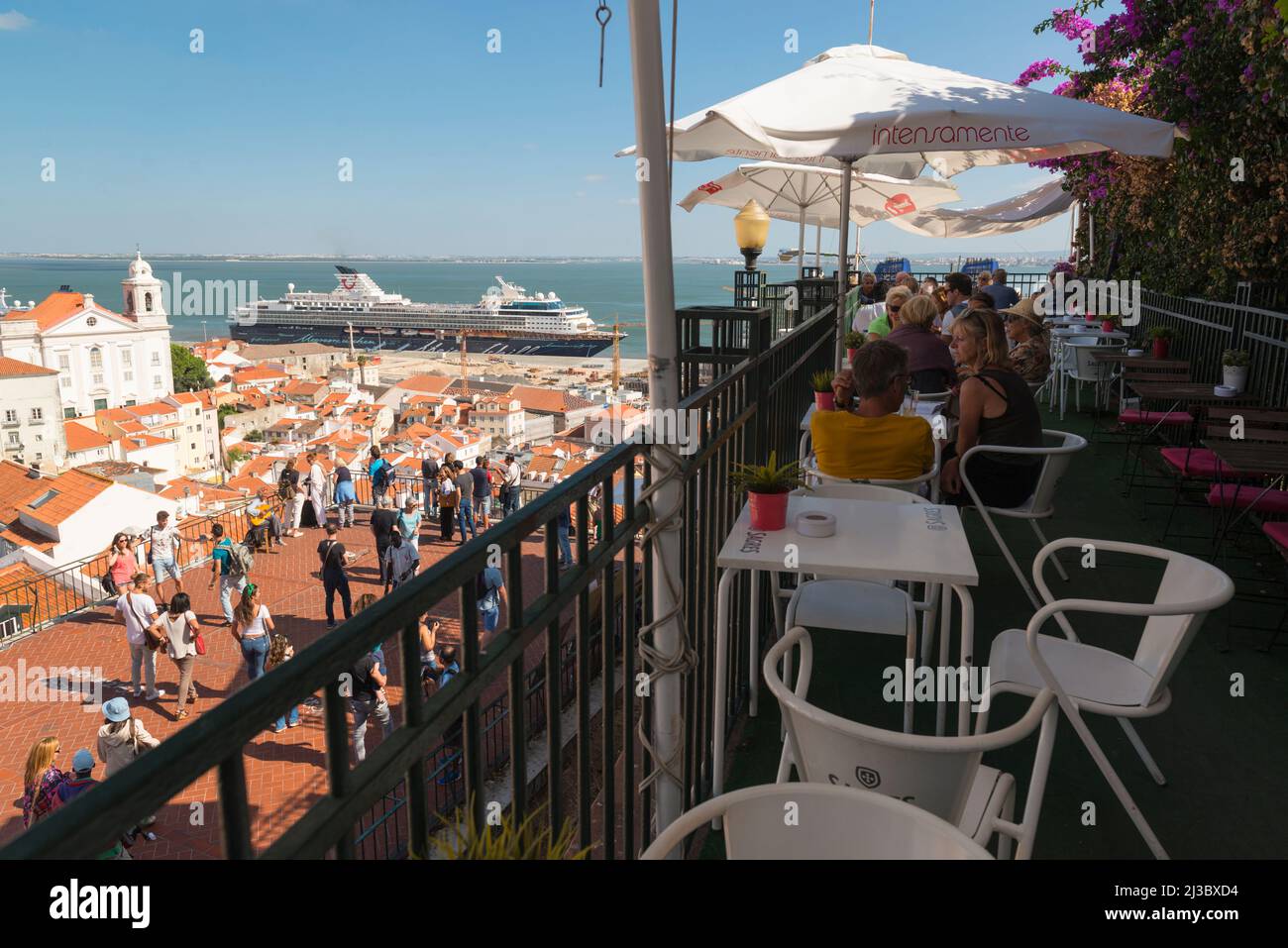Overview from a view point and terrace on Alfama district with moored TUI cruises ship Mein Schiff 1 in the harbor of Tagus river, Lisbon, Portugal. Stock Photo