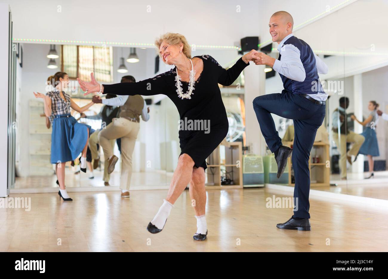 Mature woman dancing swing hi-res stock photography and images - Alamy