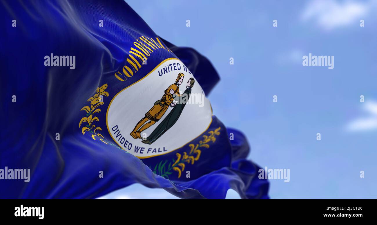 The US state flag of Kentucky waving in the wind. Kentucky is a state in the Southeastern region of the United States. Democracy and independence. Stock Photo