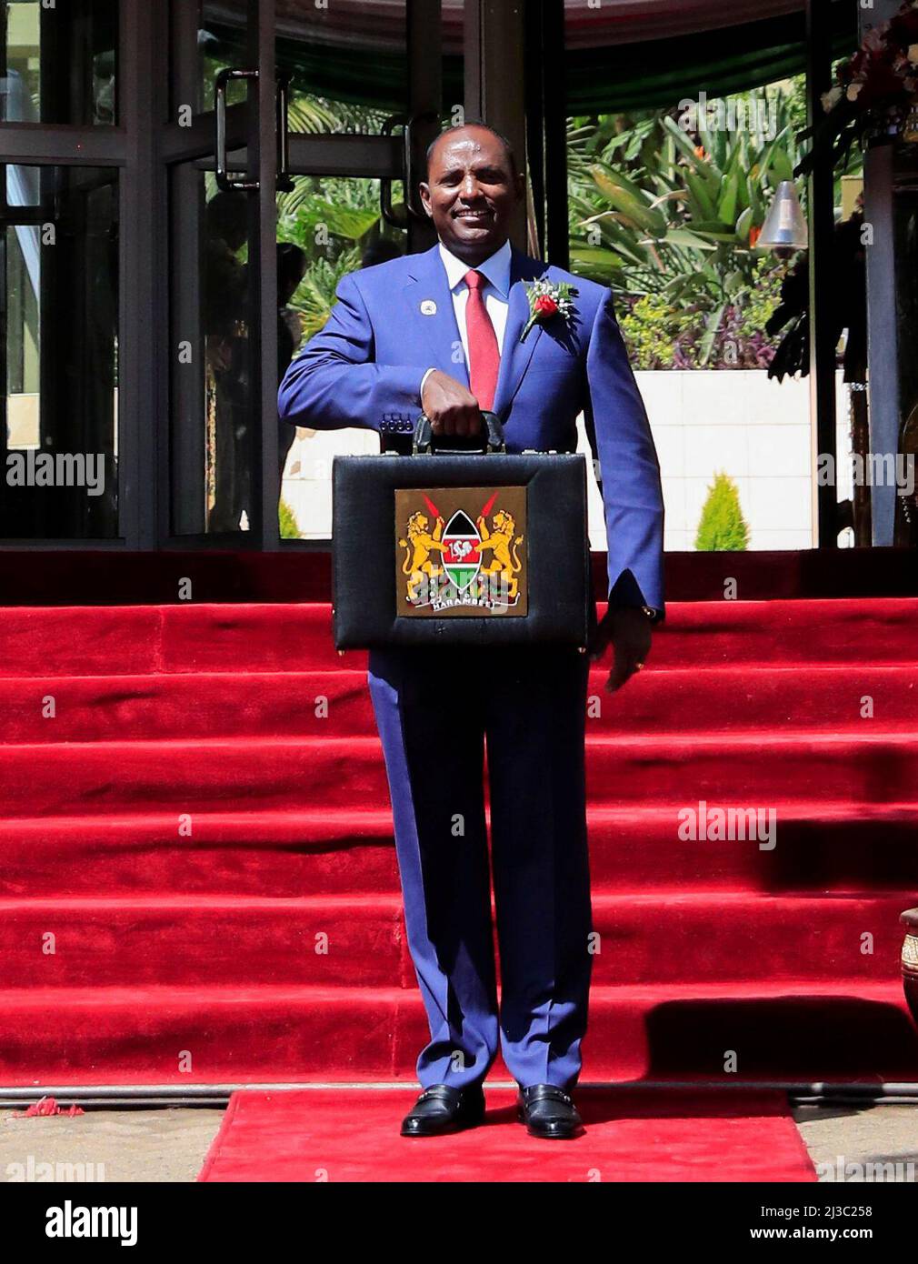 Kenya's Finance Minister Ukur Yatani holds up a briefcase containing the Government Budget for the 2022/23 fiscal year outside the National Treasury buildings in Nairobi, Kenya April 7, 2022. REUTERS/Thomas Mukoya Stock Photo