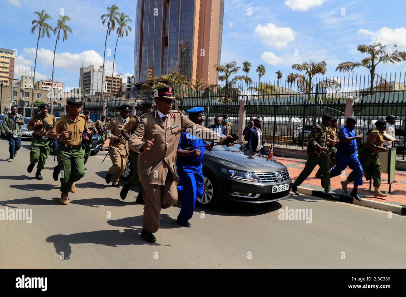 Kenya's Administrative policemen guard the vehicle carrying Finance Minister Ukur Yatani, before presenting the Government Budget for the 2022/23 fiscal year, outside the National Treasury buildings in Nairobi, Kenya April 7, 2022. REUTERS/Thomas Mukoya Stock Photo
