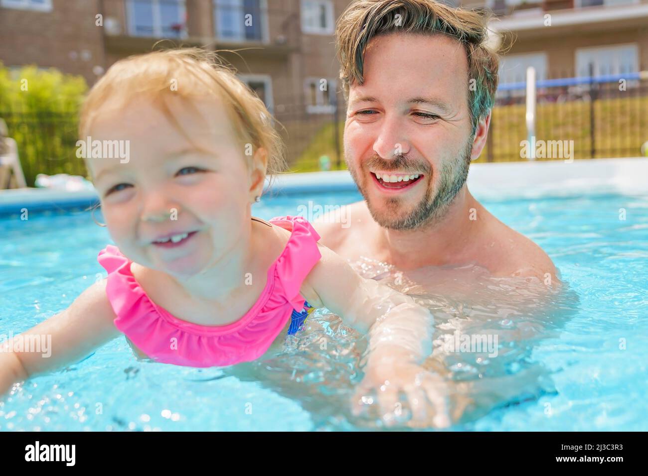 father with the child girl in the pool Stock Photo Alamy