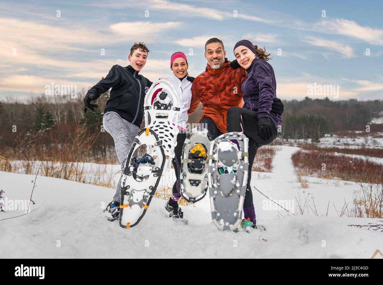 family hiking with snowshoes racket in winter day Stock Photo Alamy