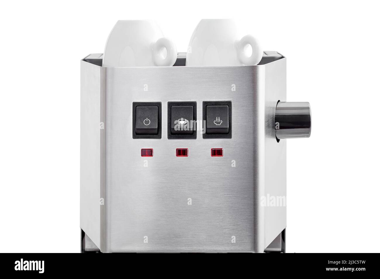 2 ceramic white espresso cups stand on warming top of a coffee machine, a steel coffee maker and black home appliance control buttons with icons and l Stock Photo