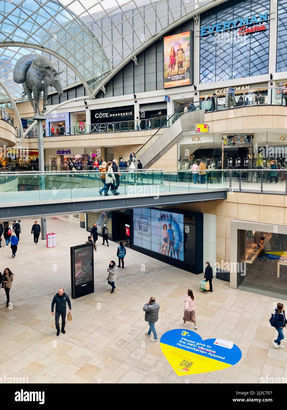 Leeds Trinity Shopping Centre with a Ukrainian flag heart advertising the DEC (Disasters Emergency Committee) Ukraine Fundraising Appeal. Stock Photo