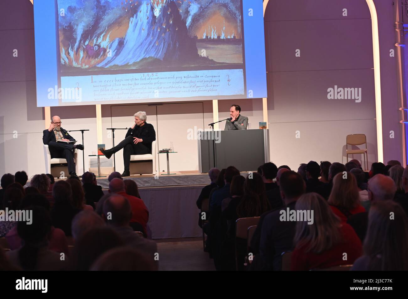 Cologne, Germany. 06th Apr, 2022. Journalist Thomas Böhm, Norwegian writer Karl Ove Knausgard and actor Thomas Loibl, l-r, read at Lit.Cologne, the international literature festival Credit: Horst Galuschka/dpa/Alamy Live News Stock Photo