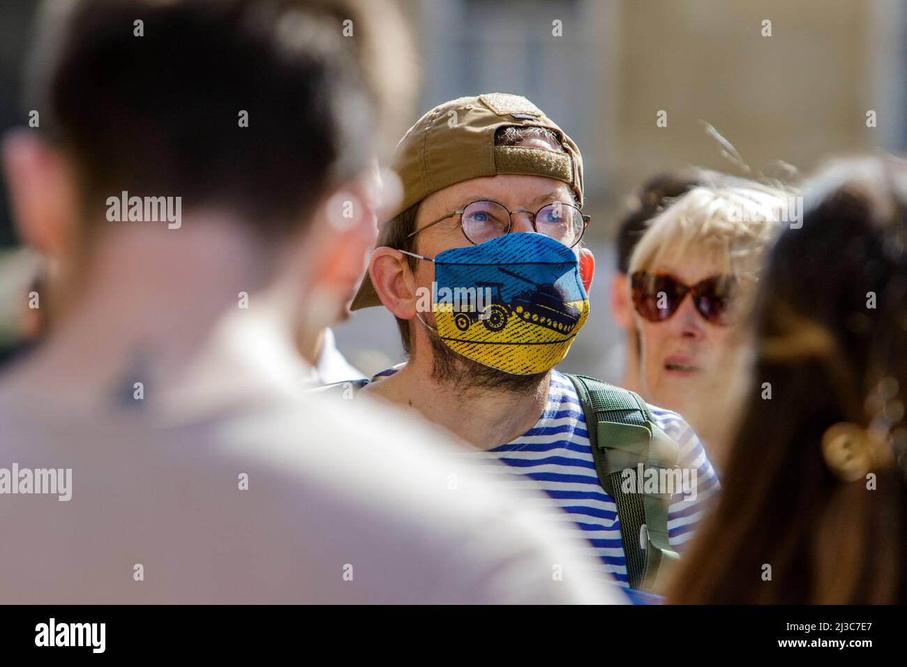 Protesters outside Bath Abbey hold anti-war placards and Ukrainian flags as they take part in a demonstration against Russia's invasion of Ukraine Stock Photo