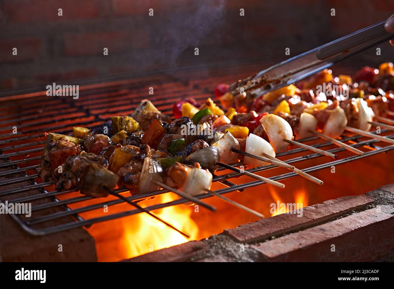 barbecue grill with smoke and flames in the kitchen Stock Photo - Alamy