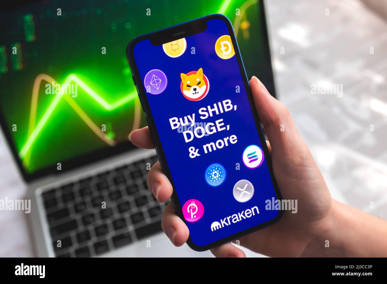 Poltava, Ukraine - April 7, 2022: Kraken crypto currency wallet app. Hand  with smartphone, logo on the screen. Stock chart background Stock Photo -  Alamy