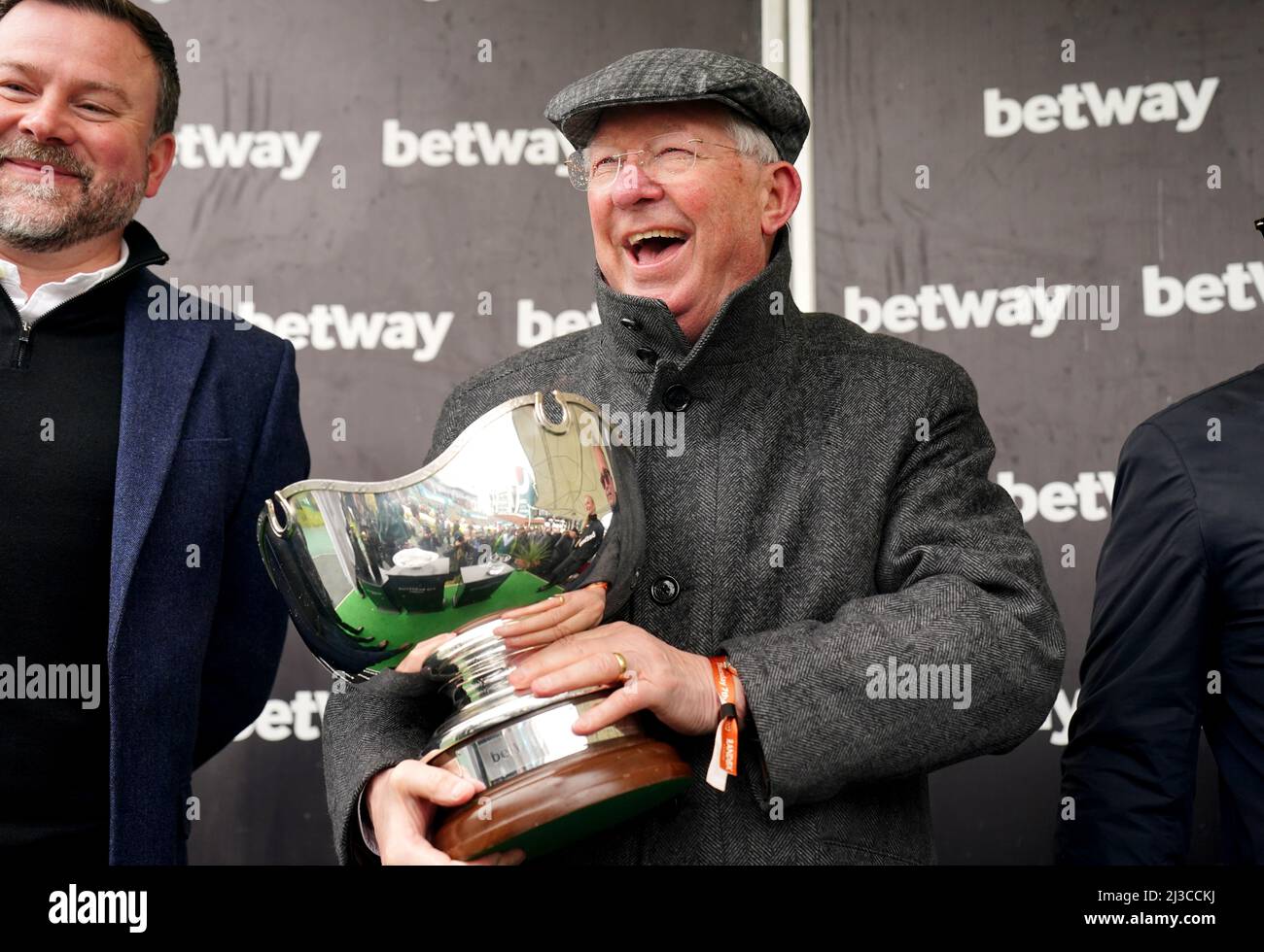 Co-owner Sir Alex Ferguson celebrates with the Betway Bowl trophy after Clan Des Obeaux wins the Betway Bowl Chase at Aintree Racecourse, Liverpool. Picture date: Thursday April 7, 2022. Stock Photo