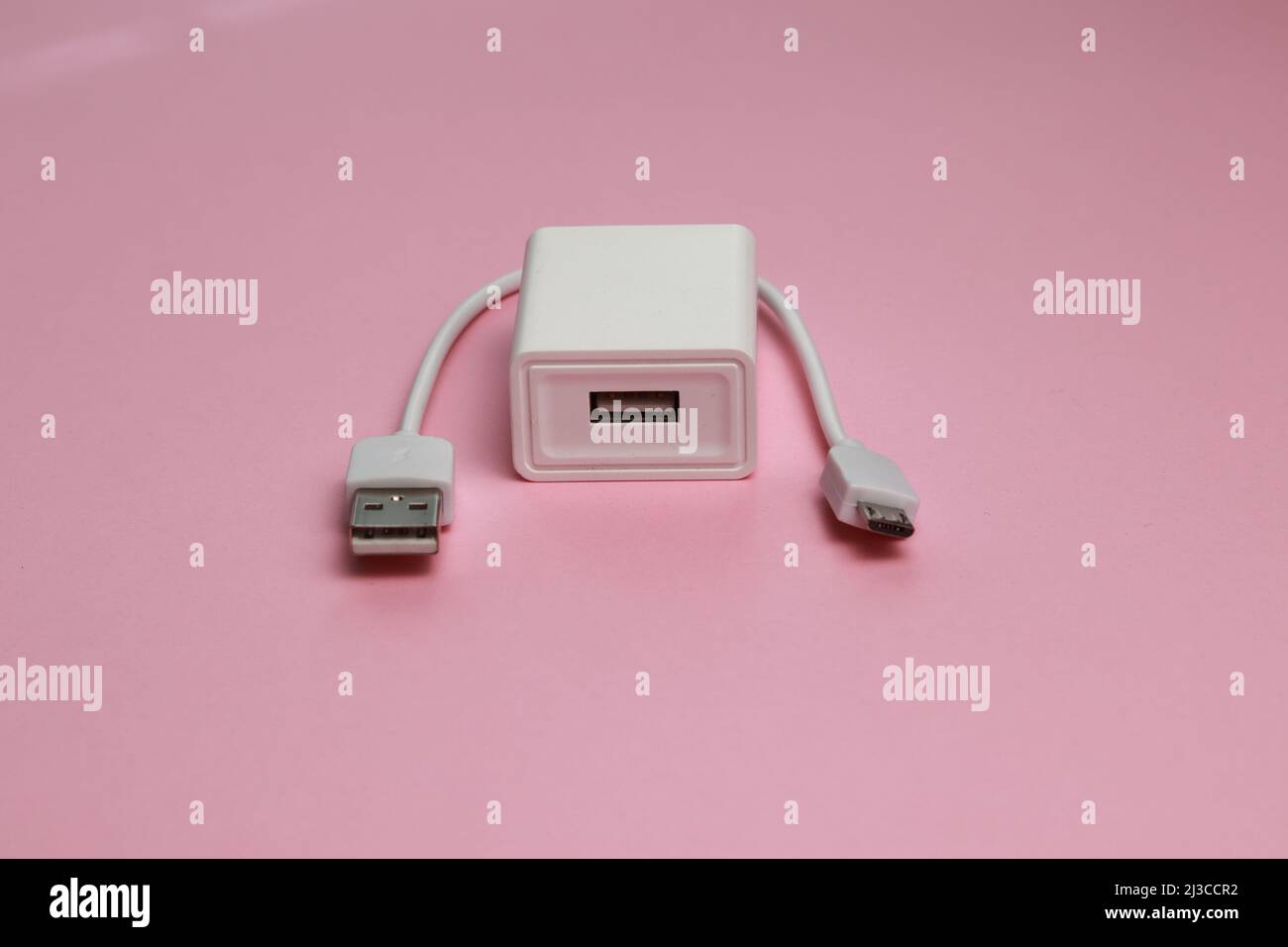 Small usb cable with a charger Stock Photo - Alamy