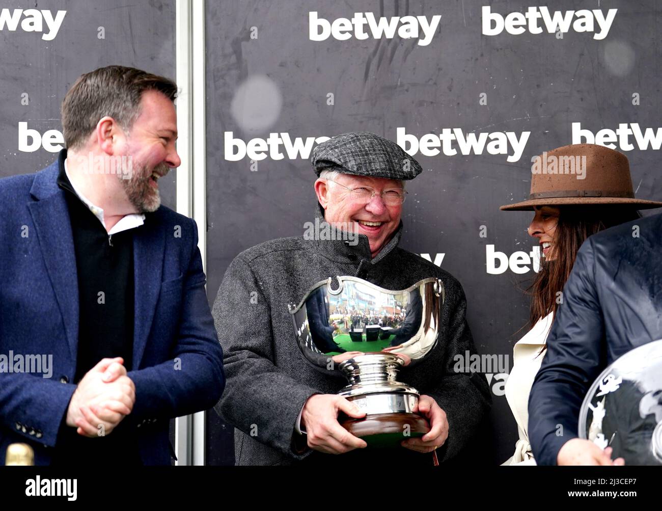 Co-owner Sir Alex Ferguson celebrates with the Betway Bowl trophy after Clan Des Obeaux wins the Betway Bowl Chase at Aintree Racecourse, Liverpool. Picture date: Thursday April 7, 2022. Stock Photo