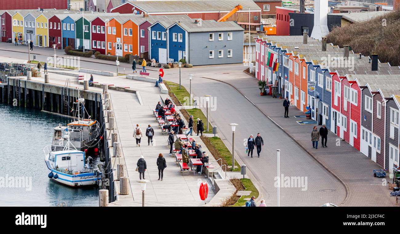 Helgoland, Germany. 26th Mar, 2022. View of Helgolands harbor street with the characteristic lobster stalls. Credit: Markus Scholz/dpa/Alamy Live News Stock Photo