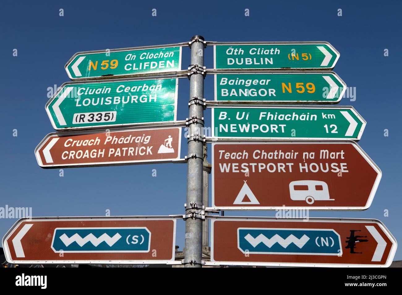 tourist and main roadsigns including wild atlantic way brown roadsign tourist route in westport county mayo republic of ireland Stock Photo