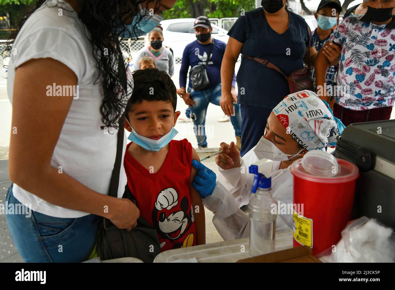 Cucuta, Colombia. 30th Mar, 2022. A health worker administers a dose of COVID-19 vaccine to a child in the neighborhood of La Parada, near the Colombia-Venezuela border. 502 Colombian communities in the country already have more than 70% of their population with a complete vaccination schedule against covid-19, and lifted the measure of the use of face masks in open spaces. (Credit Image: © Jorge Castellanos/SOPA Images via ZUMA Press Wire) Stock Photo
