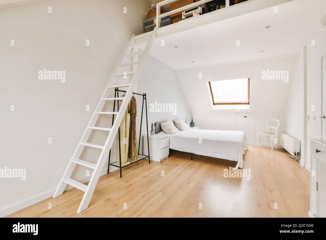 Interior of modern bedroom with comfortable bed and sofa placed on