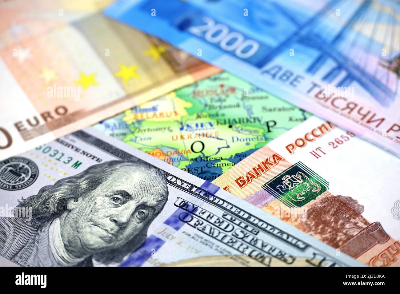 US dollars, Russian rubles and Euro currency on map of Ukraine. Concept of american and european support for Kiev during special military operation Stock Photo