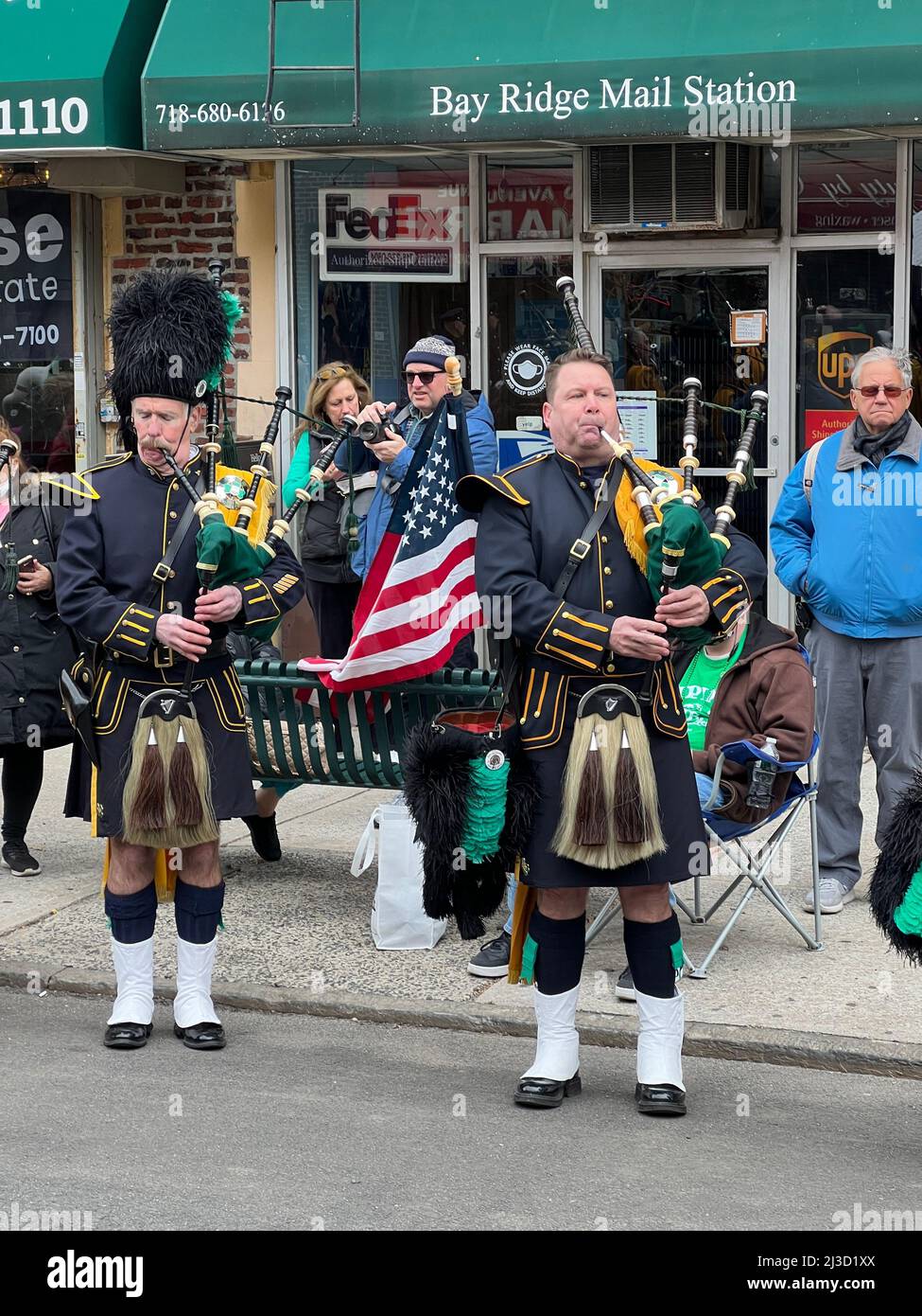 Members of the Emerald Society Bagpipe Band tune up before marching in the Bay Ridge, Brooklyn