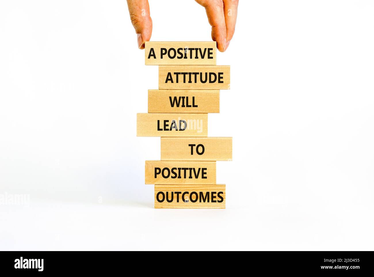 Think positive symbol. Wood blocks with words A positive attitude will come to positive