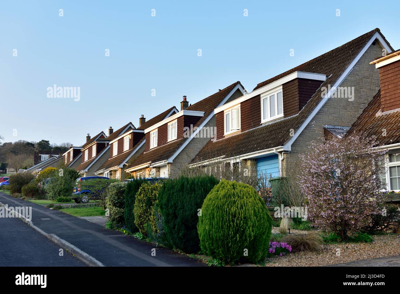 Row of modern English detached houses with double dormer windows, UK Stock Photo