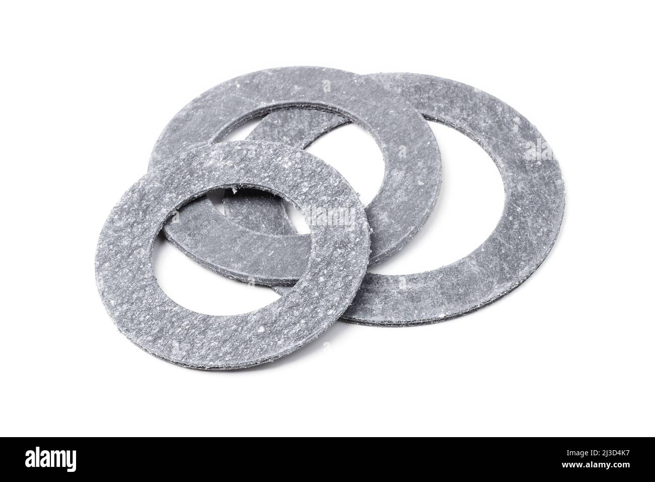 Round paronite gaskets for pipe flange connections isolated on white