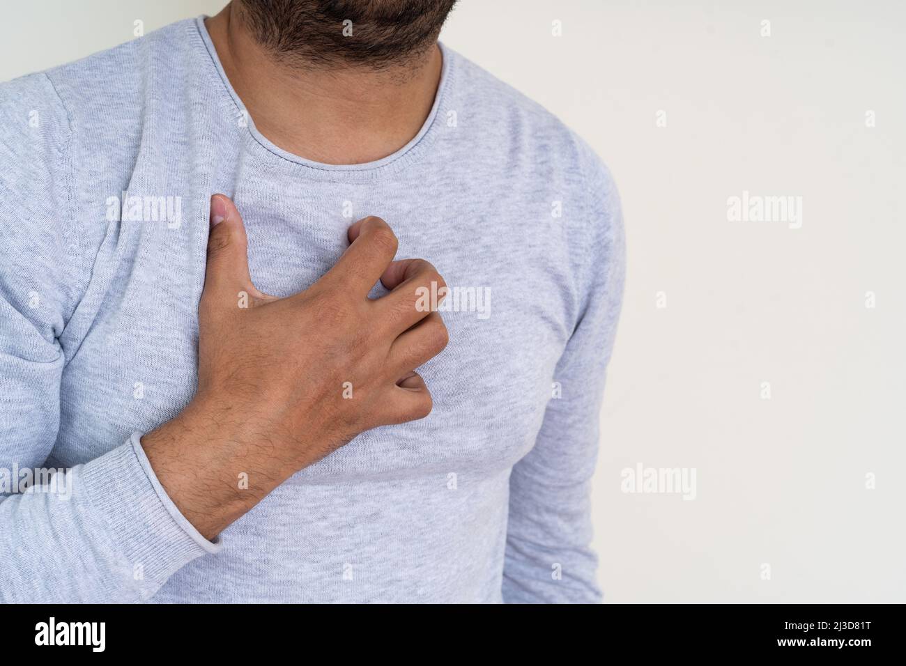 Close up photo of man suffer from acid reflux, heartburn and gerd. Stock Photo