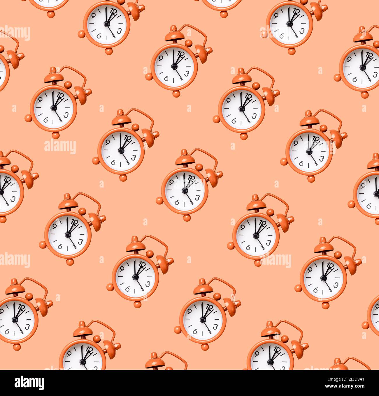 Retro alarm clock pattern on coral background. Time, accuracy concept. High quality photo Stock Photo