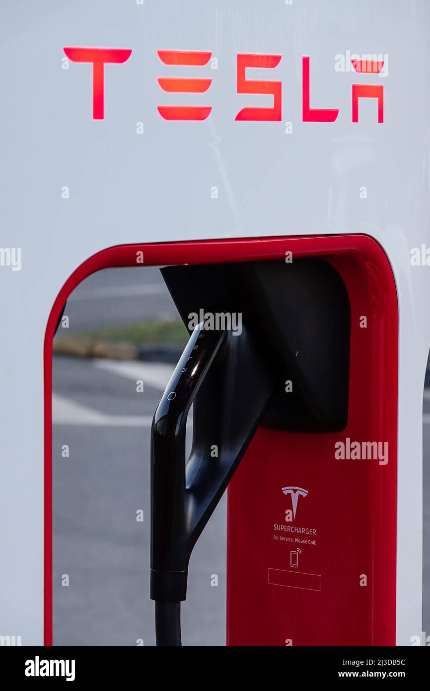 Tesla charging station to welcome electric car owners. Turin, Italy - April 2022 Stock Photo