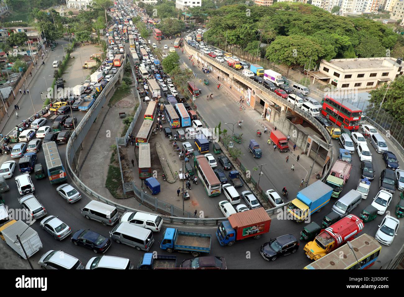 DHAKA,BANGLADESH,APRIL 07,2022 Commuters make their way through a traffic jam in Dhaka