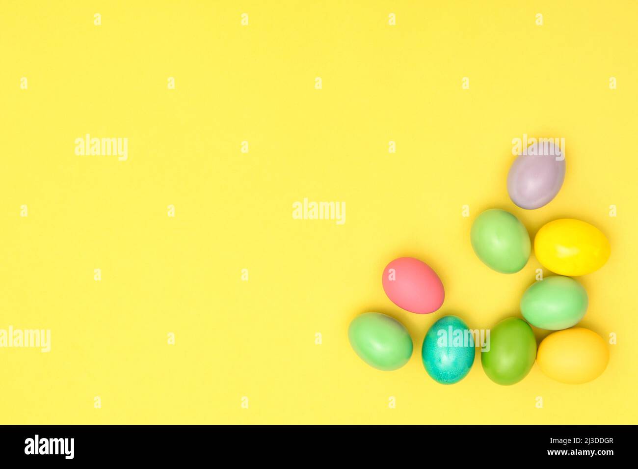 Easter eggs decoration on yellow paper background Stock Photo