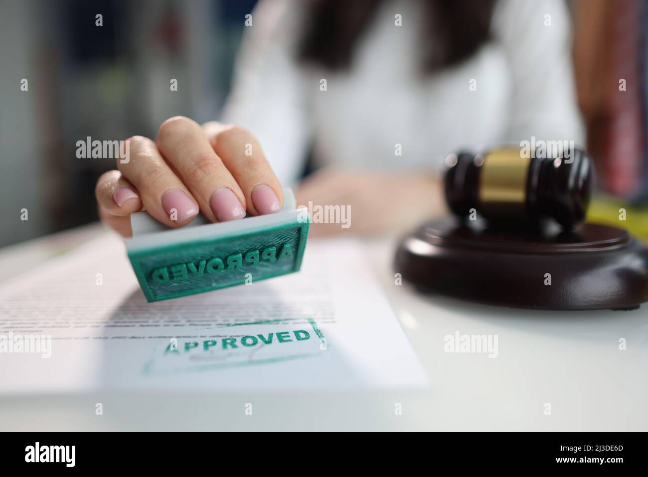 Judge puts approved seal on document in court closeup Stock Photo Alamy