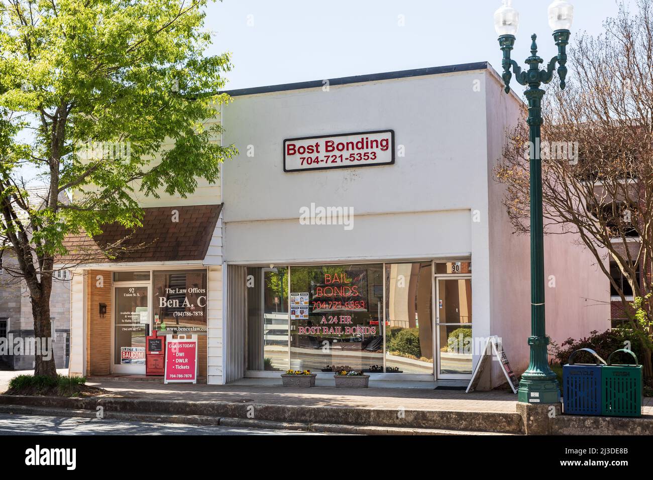 CONCORD, NC, USA-3 APRIL 2022: Office of Bost Bonding, a bail bonding company, with Law Offices of Ben A. Cox next door. Stock Photo