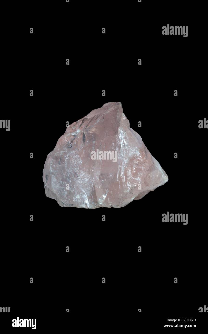 Rose quartz, mineral stone on black background. Stock Photo