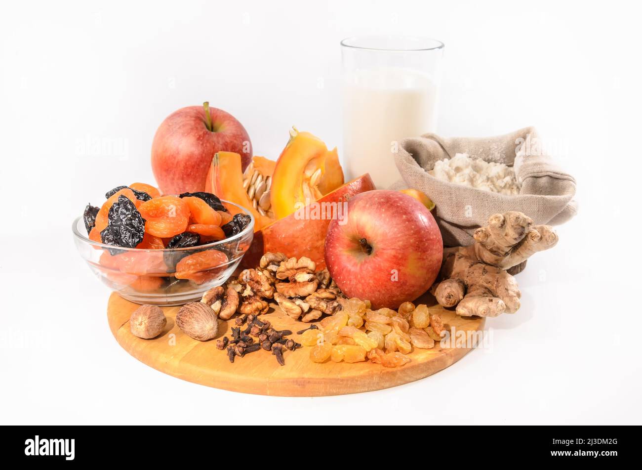 pumpkin and ingredients for pumpkin casserole with nuts and dried fruits on a light background Stock Photo