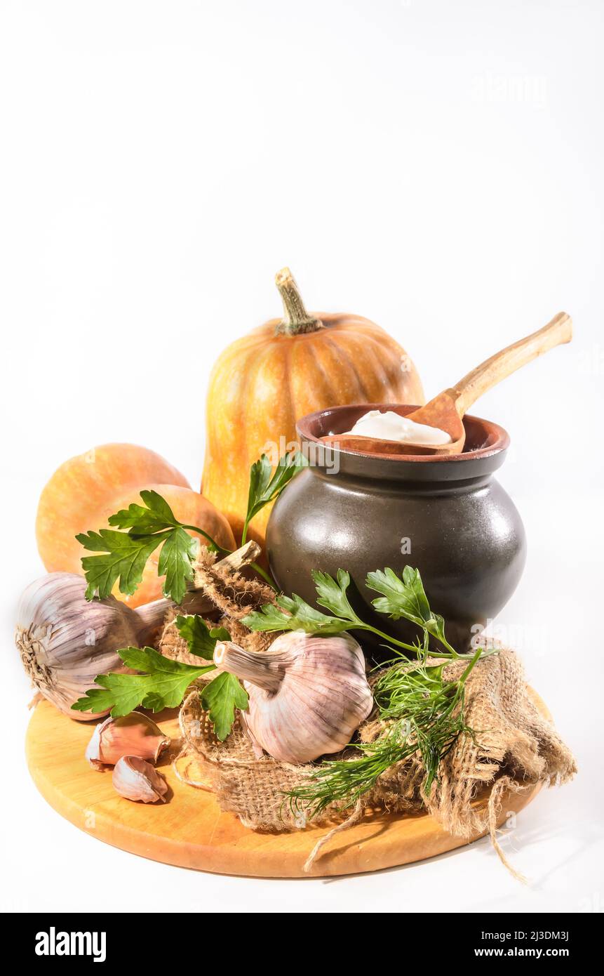 pumpkin and ingredients for sour cream sauce on a light background Stock Photo
