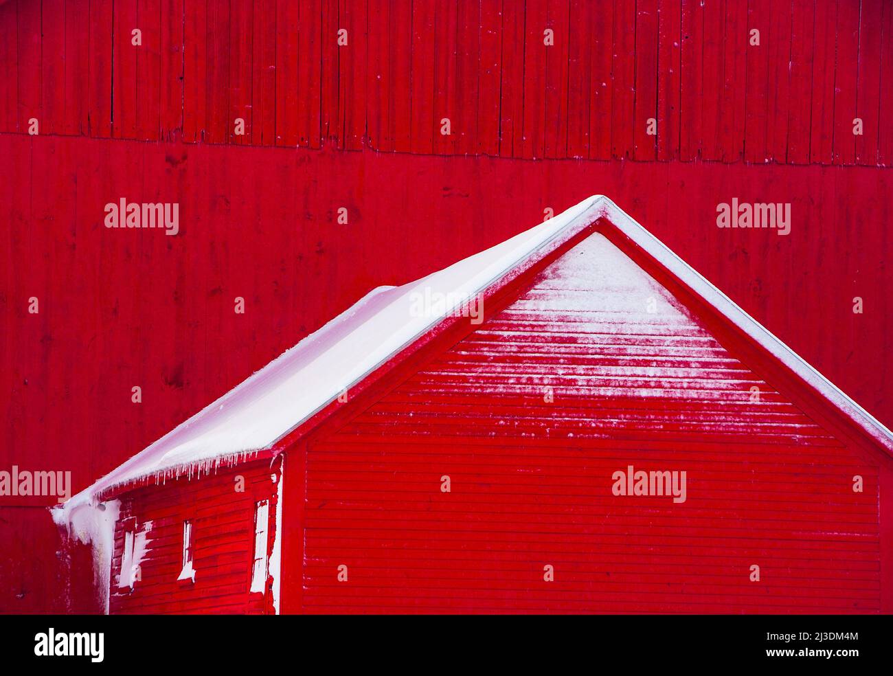 A red barn with snow in Vermont, USA Stock Photo