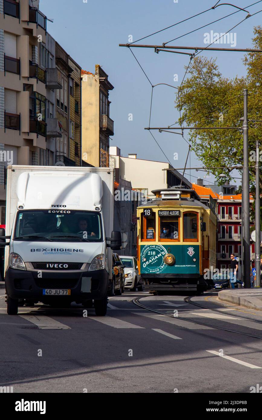 Porto tram 218 at a busy junction in the city centre of Porto in Portugal. Stock Photo
