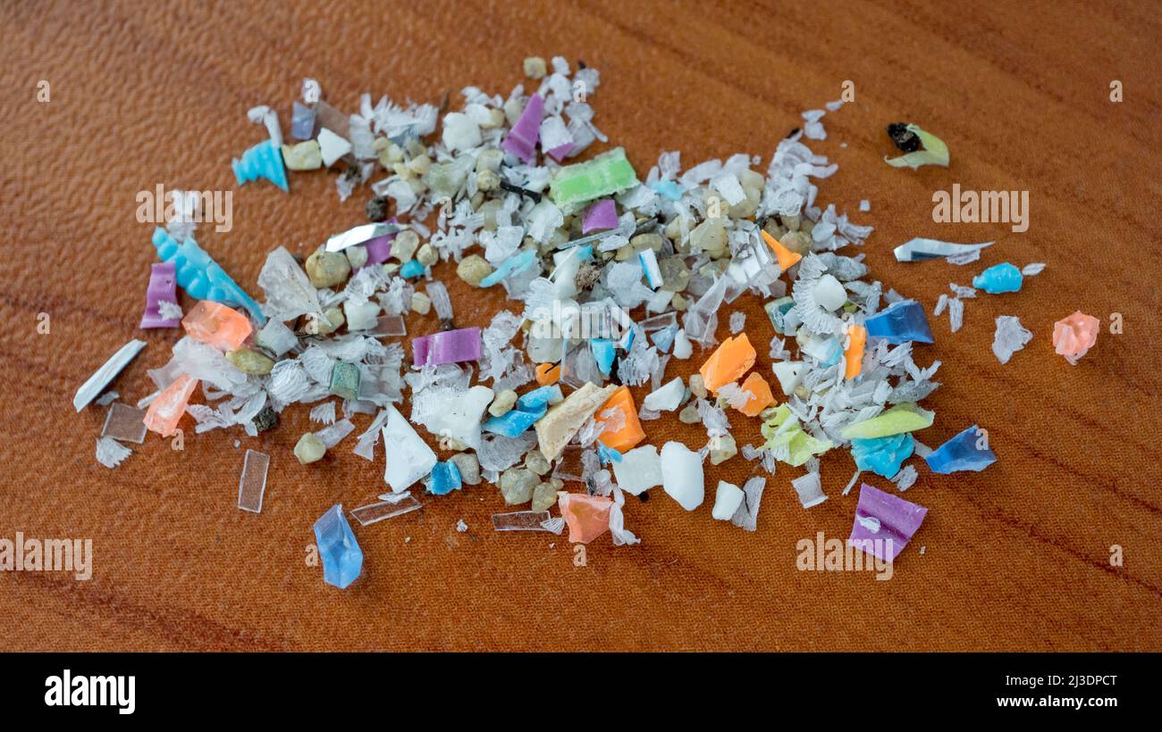 Marco top shot of a pile of microplastics. Concept for water pollution and global warming. Climate change idea. Stock Photo