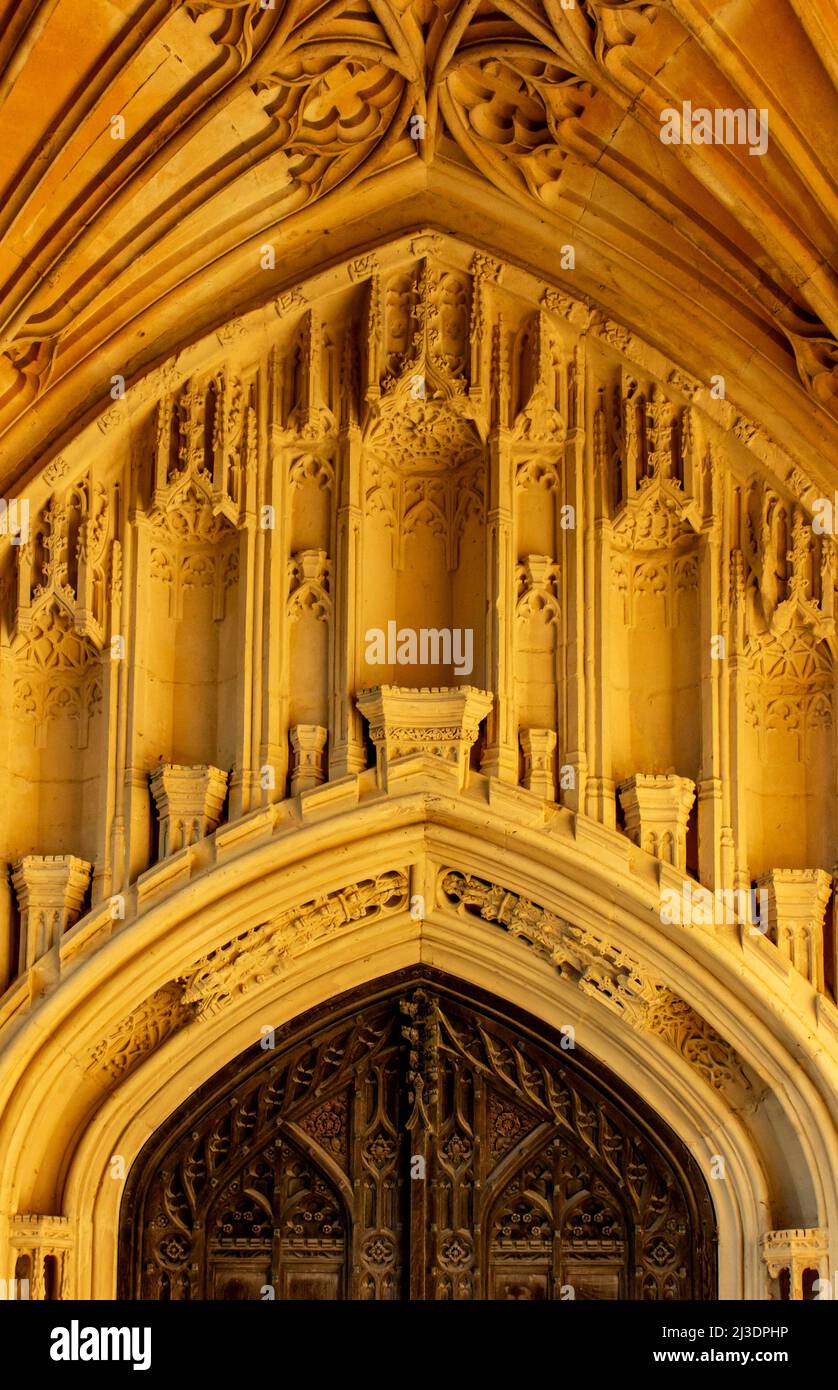 Detail of stonework and wooden door at Tewkesbury Abbey in Gloucestershire England UK Stock Photo