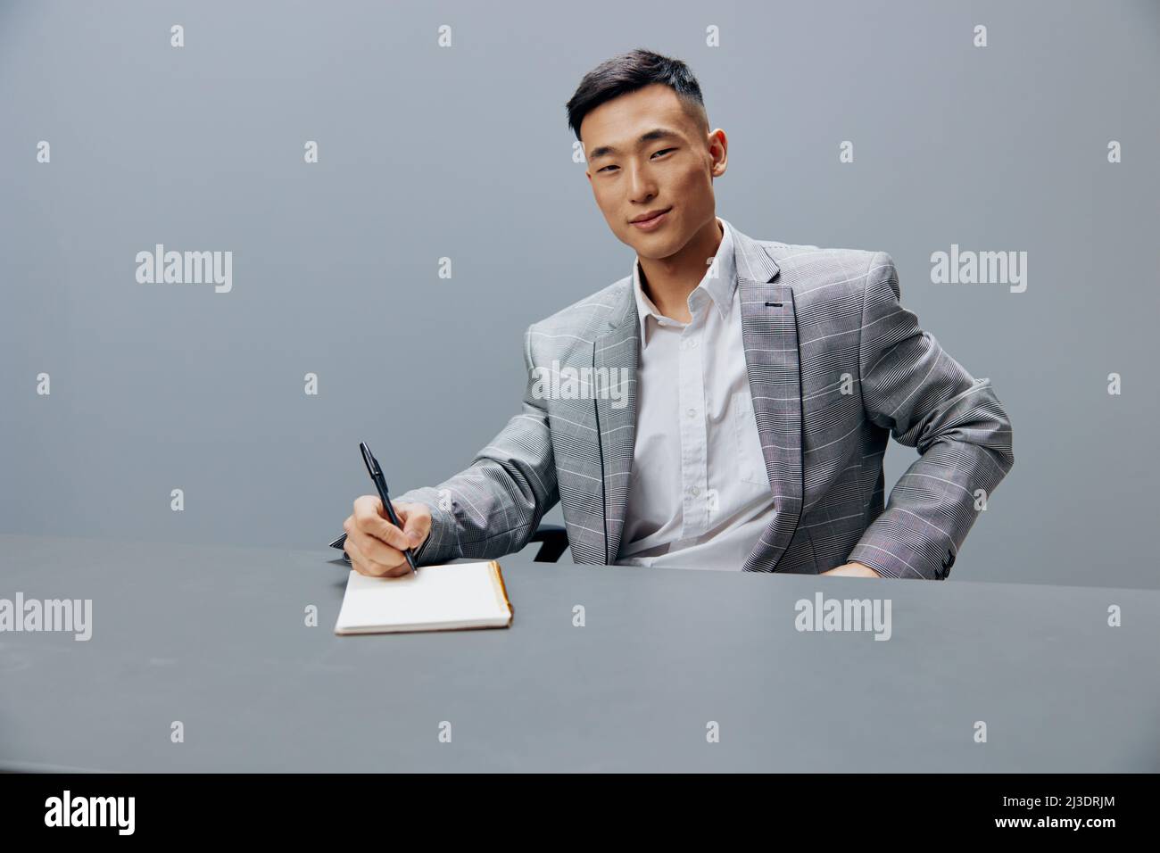 man with a notepad on the table sits at the office desk executive Stock Photo Alamy