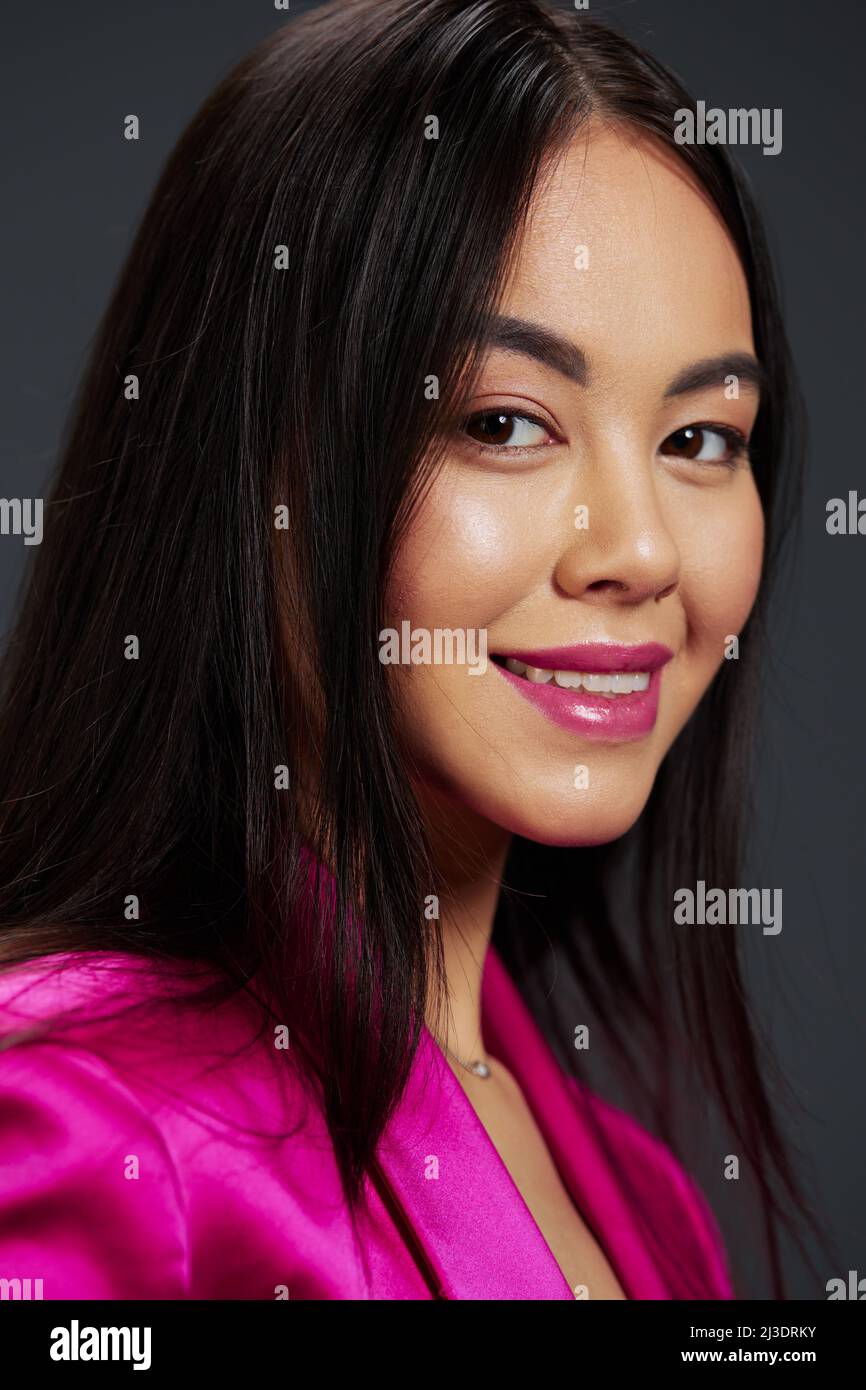 woman bright makeup pink dress modern style studio model Stock Photo