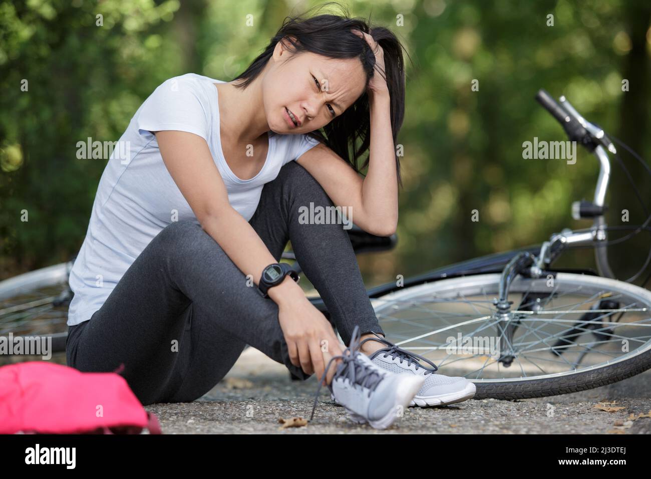 woman with leg pain because of twisted ankle Stock Photo Alamy