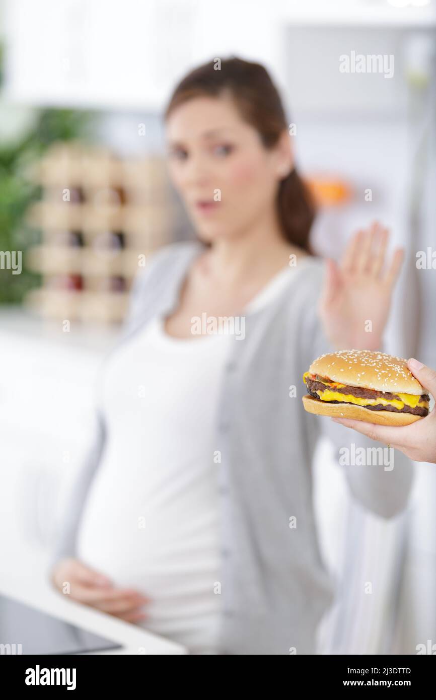portrait of pregnant woman rejecting to eat junk food Stock Photo Alamy