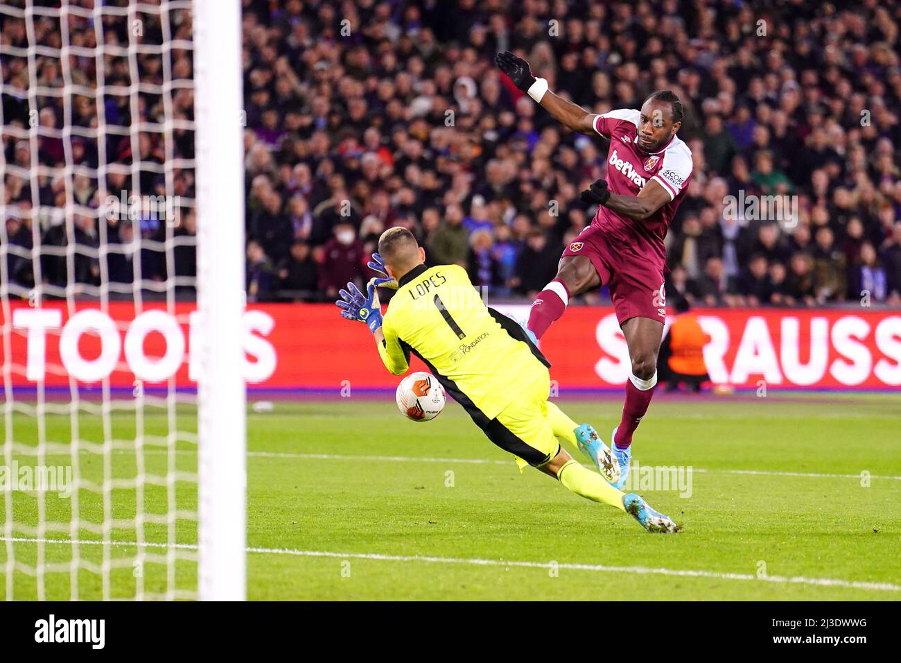 West Ham United's Michail Antonio (right) has his shot saved by Lyon goalkeeper Anthony Lopes during the UEFA Europa League quarter final first leg match at London Stadium, London. Picture date: Thursday April 7, 2022. Stock Photo